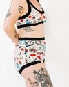 Side view of Thunderpants Sky Rise Inked Up underwear showing high-rise fit and full tattoo print