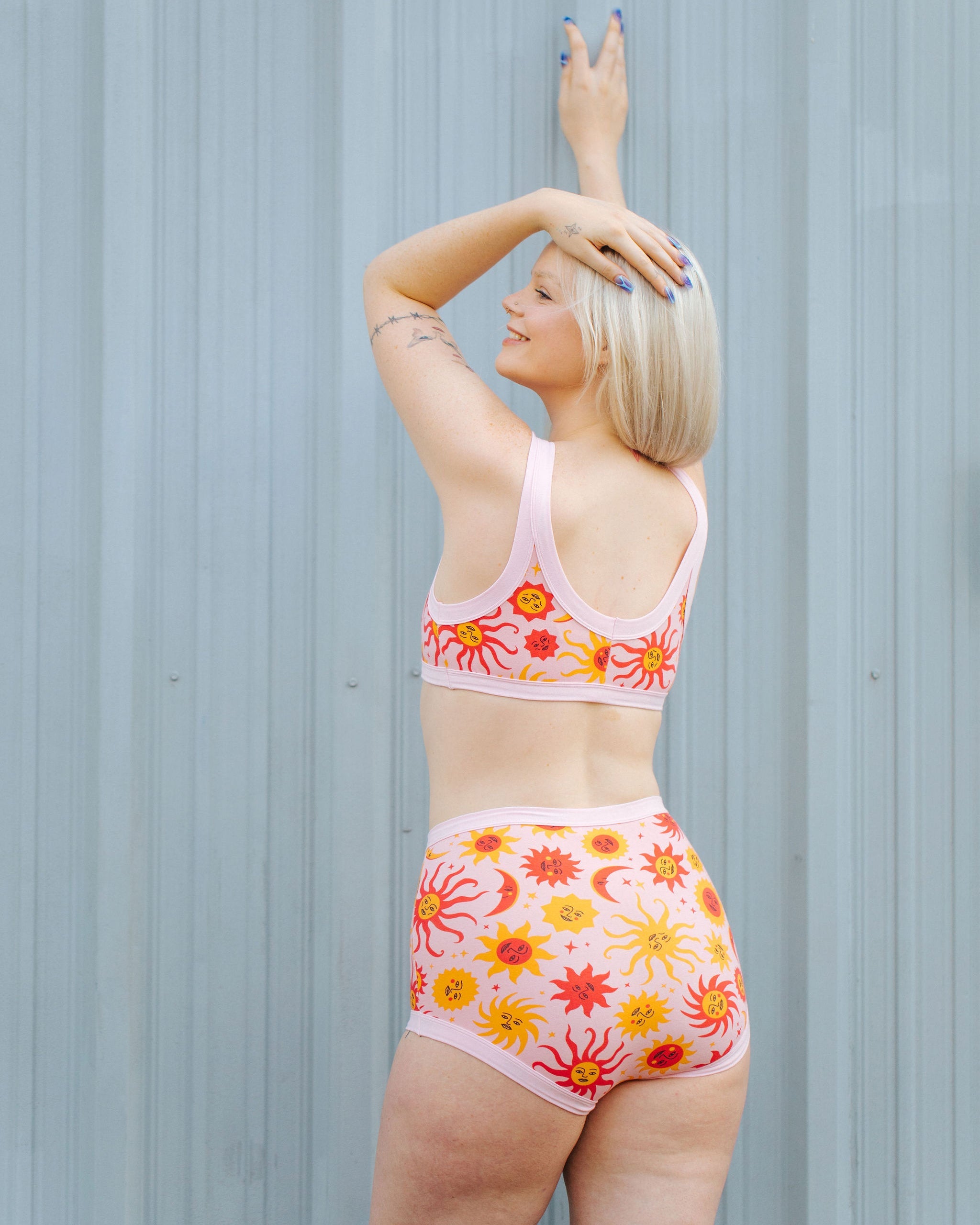Flat lay of Thunderpants Sky Rise Luna y Sol organic cotton underwear with vibrant celestial print