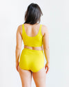 Side view of Thunderpants Sky Rise underwear in Star Fruit yellow chartreuse on model