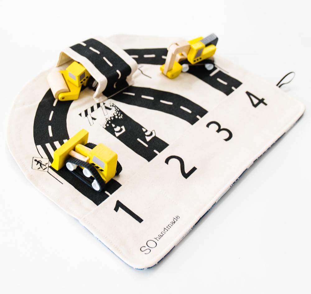 Children's toy with roads and cars on a white background