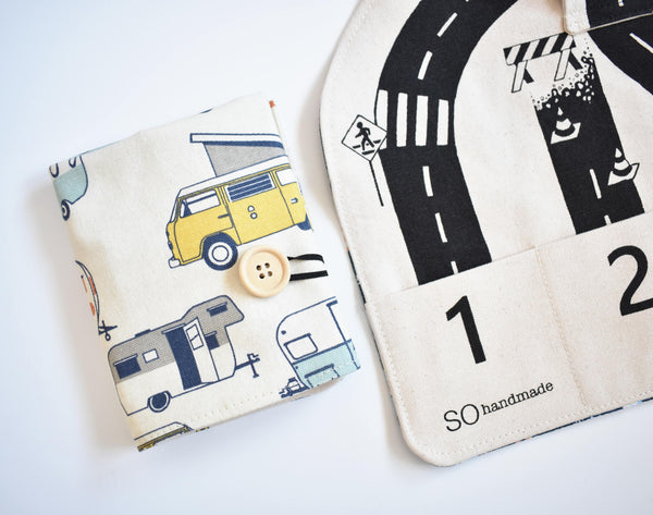 Two fabric items with road and vehicle patterns on a white background