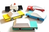 Colorful toy cars made from paper or cardboard on a white background