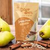 Dory Oats Spiced Pear overnight oats package with pears and cinnamon on a wooden surface