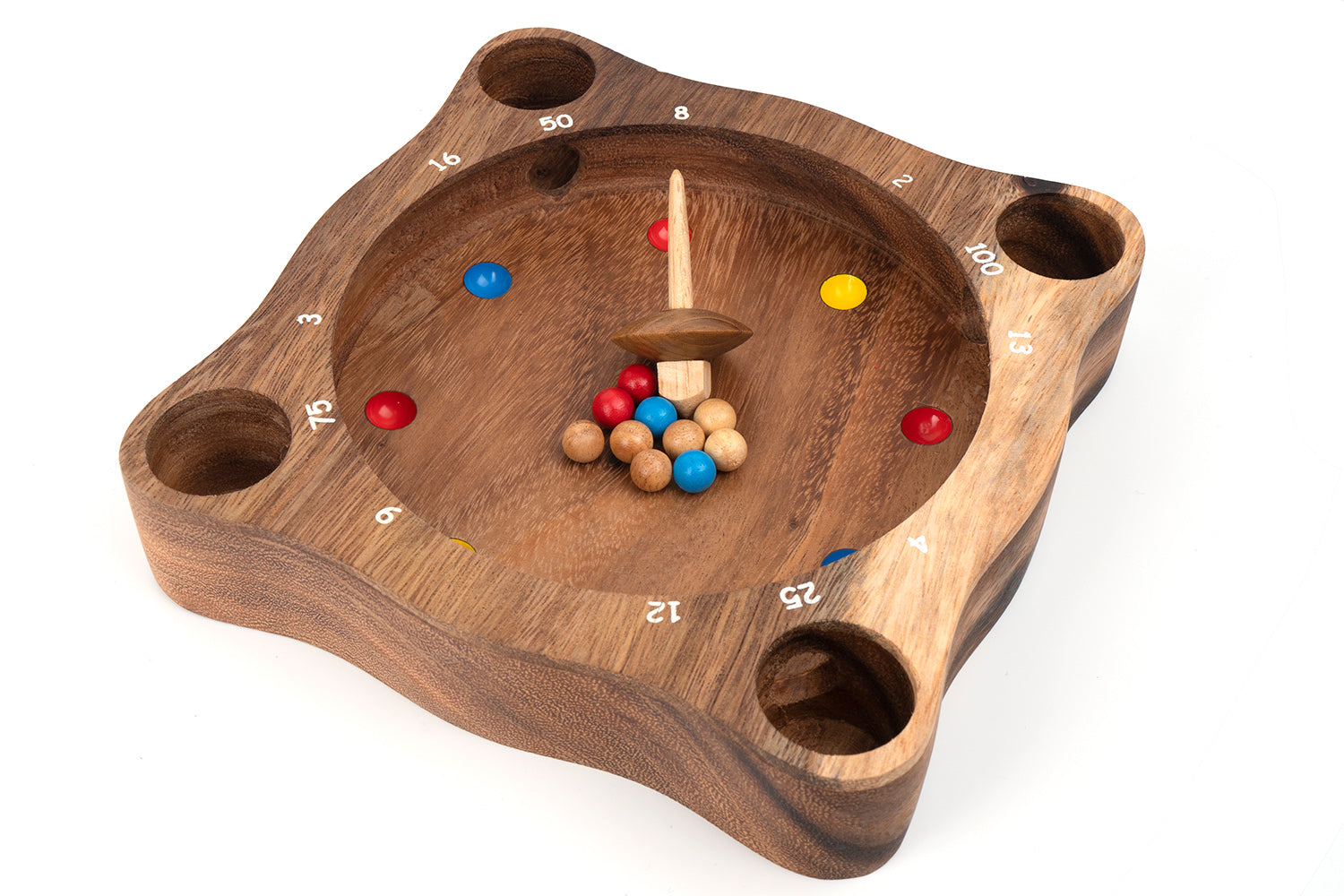 Wooden game board with holes and colored balls on a white background