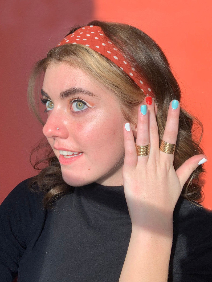 Close-up of Stacked Armor Statement Ring by Fair Anita worn on hand showing layered brass rings