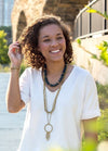 Close-up of Beaming Rays Artillery Necklace beads showing handcrafted recycled brass bullet casing detail