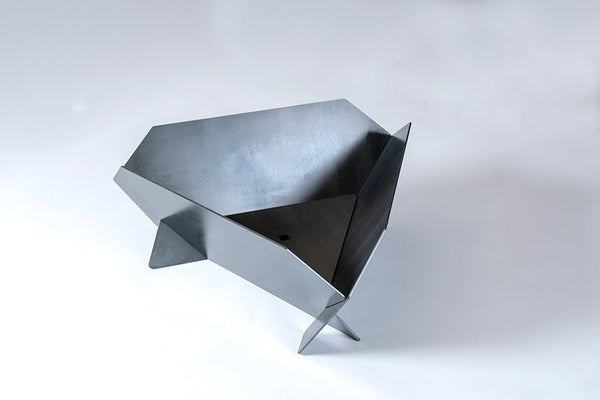 Metallic, geometric chair on a white background