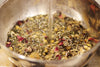 Close-up of herbal steam facial blend botanicals including lavender, calendula and mint in recyclable jar