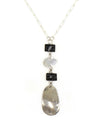 Close-up of the Stepping Stone Pendant Necklace showing silver and black pendant detail, by Fair Anita