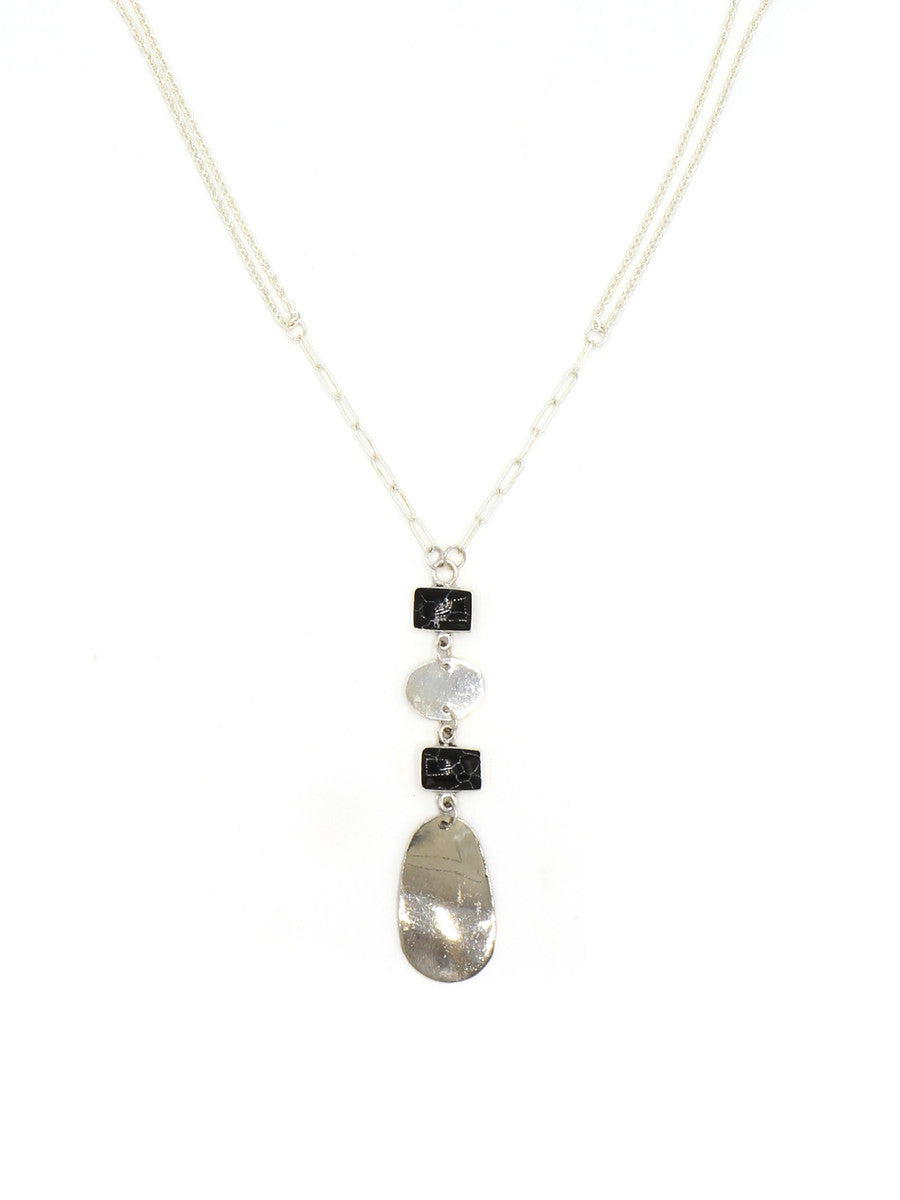 Close-up detail of the Stepping Stone Pendant Necklace silver chains and black pendant by Fair Anita