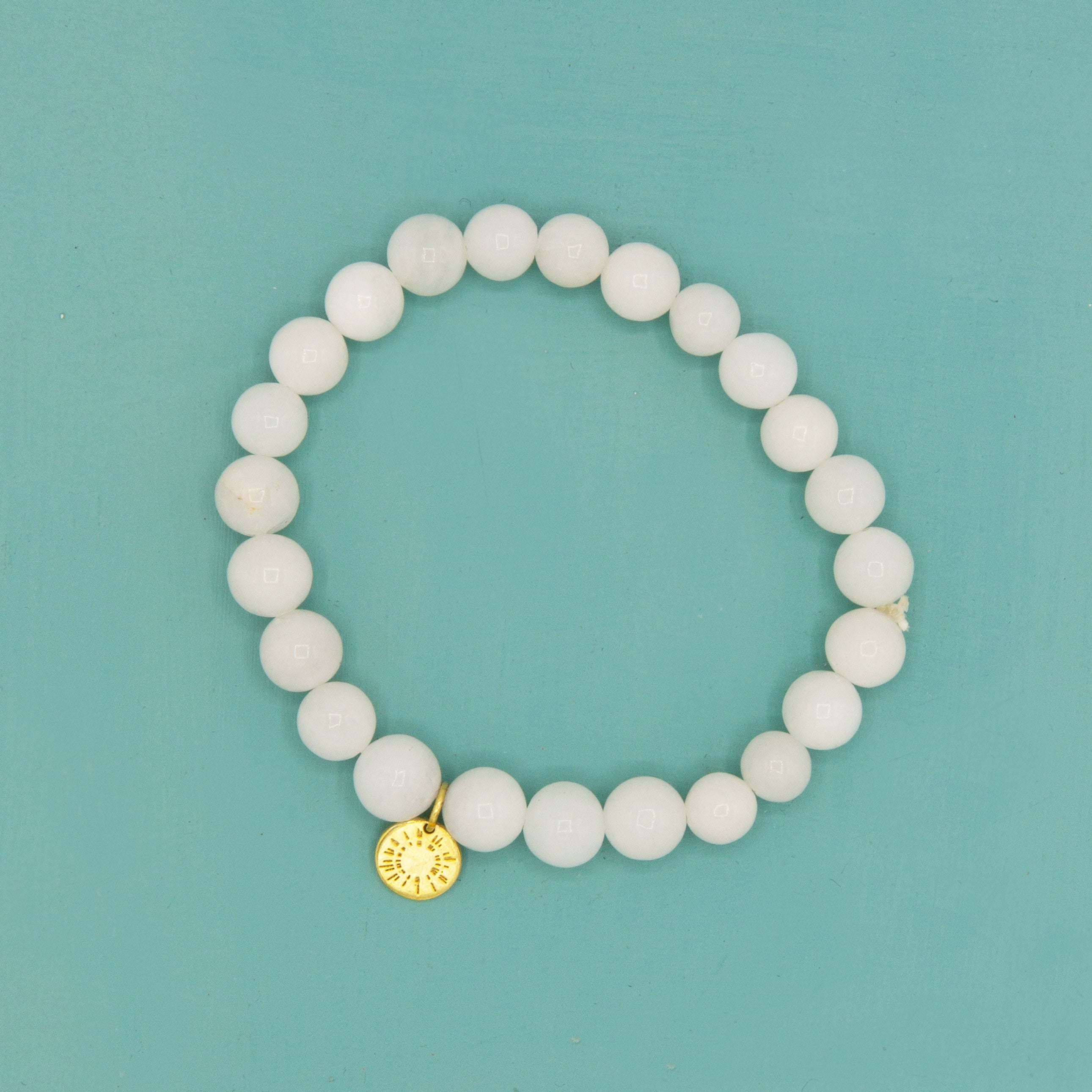 White agate elastic stretch bracelet with burst charm by Fair Anita