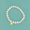 White agate elastic stretch bracelet with burst charm by Fair Anita