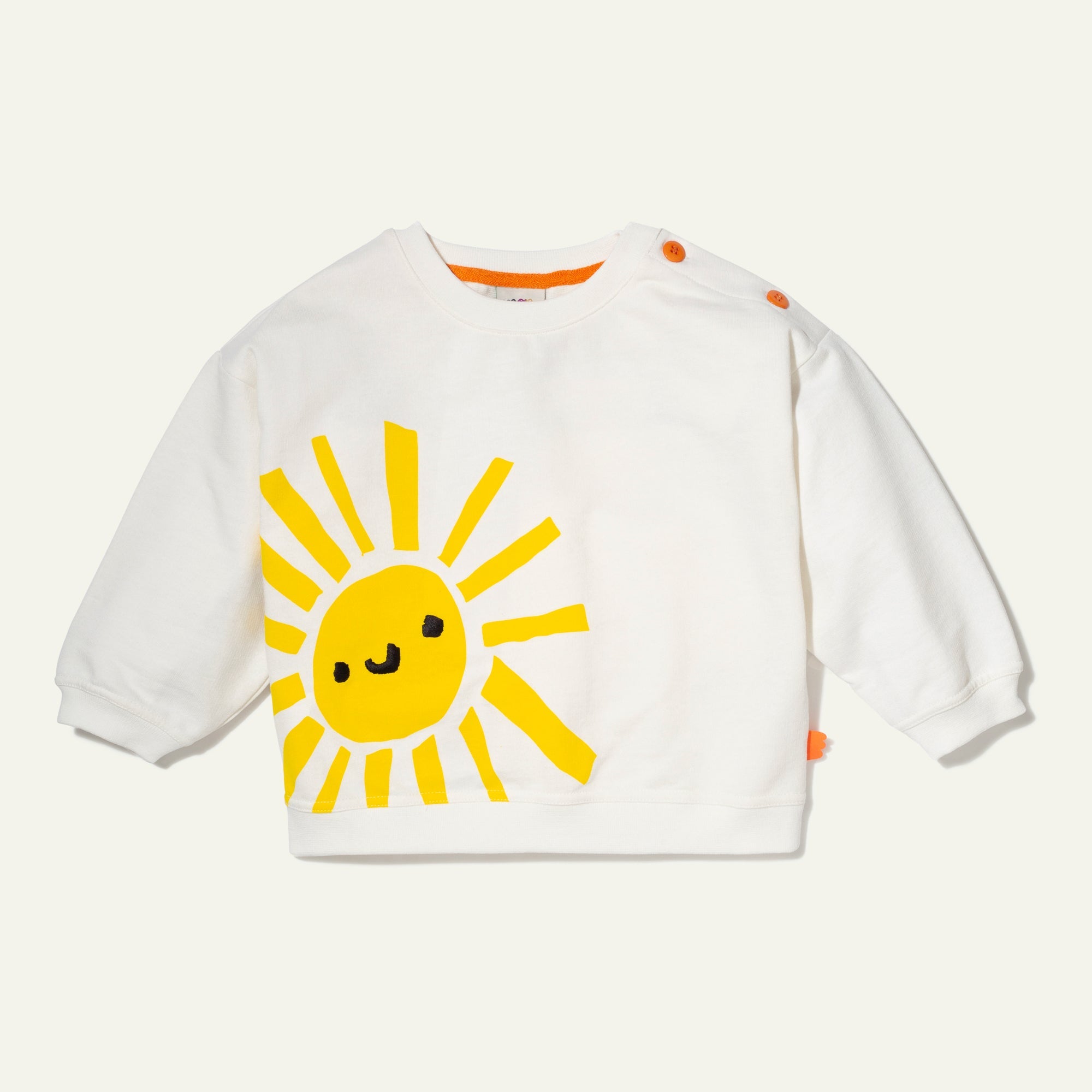 White sweatshirt with a yellow sun design on a white background