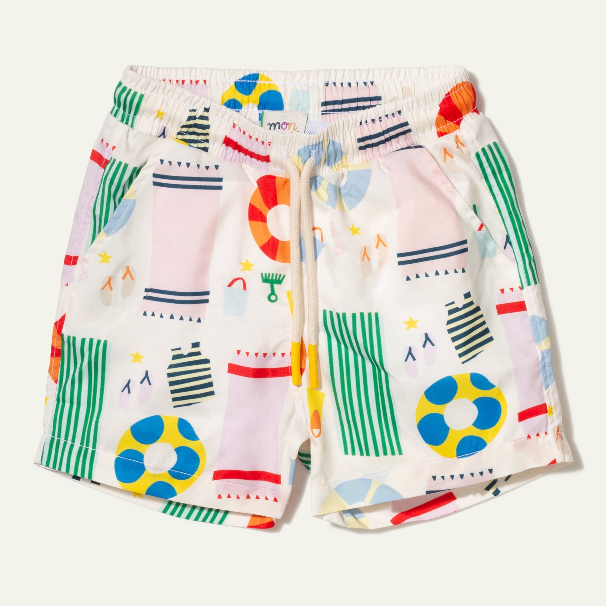 Colorful children's shorts with abstract patterns on a white background