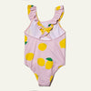 Pink one-piece swimsuit with lemon pattern on a white background