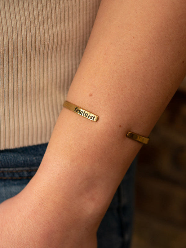 Ethically handcrafted feminist cuff bracelet in recycled brass