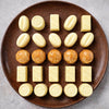 Sugar free white chocolate pralines by Andy Anand arranged in elegant gift box packaging
