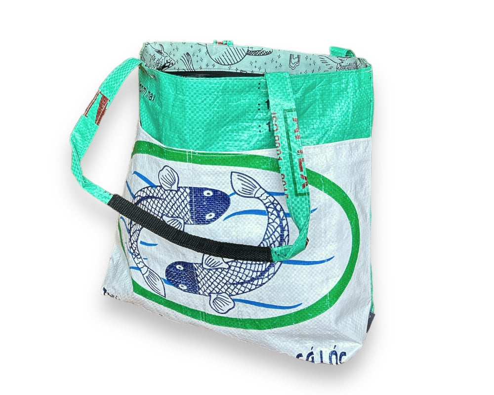 The Barrel Tote is the ultimate eco-friendly companion for your everyday adventures. Made from recycled materials and featuring a spacious design, this durable tote bag is perfect for shopping, work, or travel. Experience the perfect combination of function and sustainability. Order yours today!