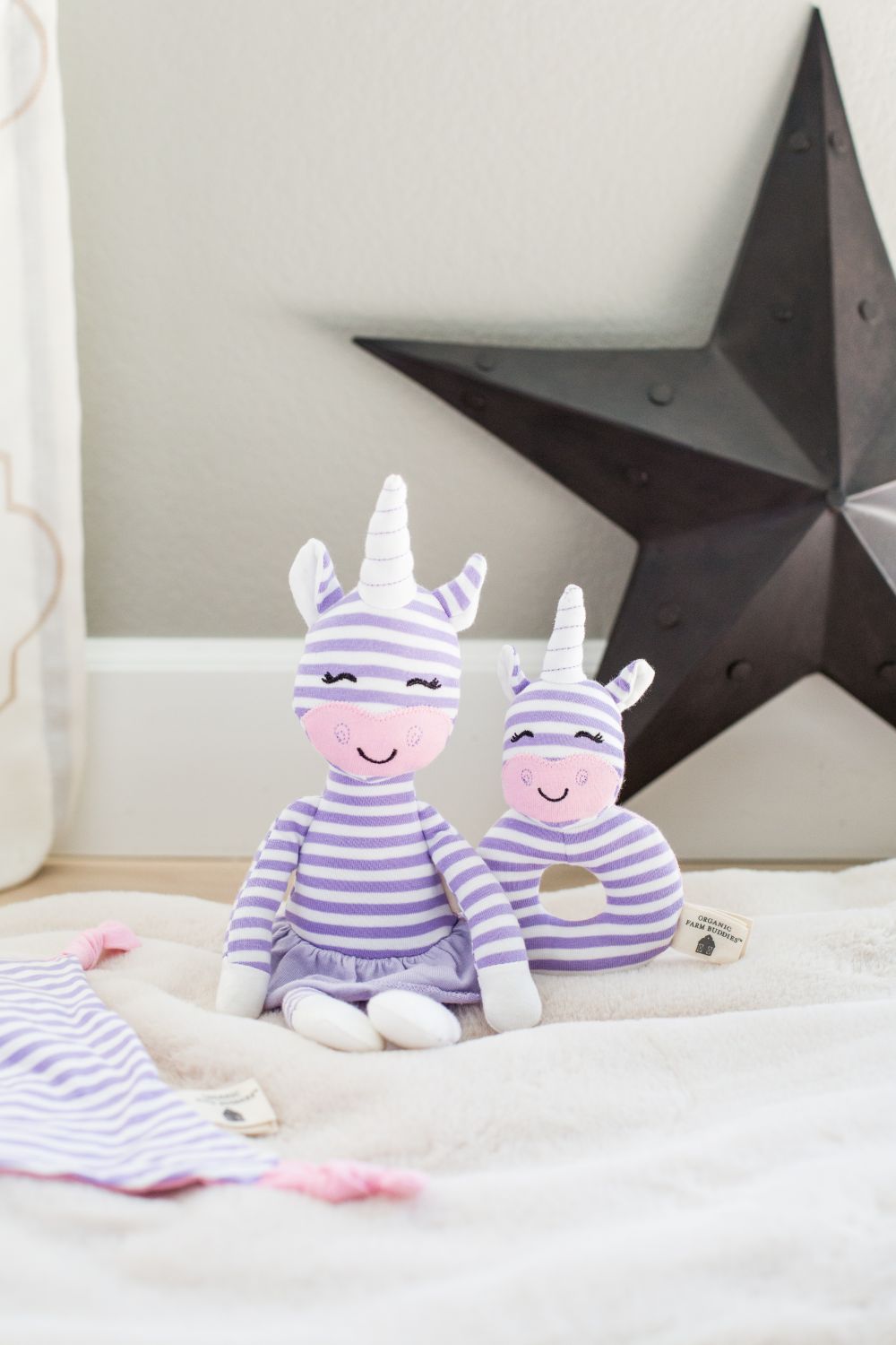 Cupcake the Unicorn teething rattle with embroidered face details