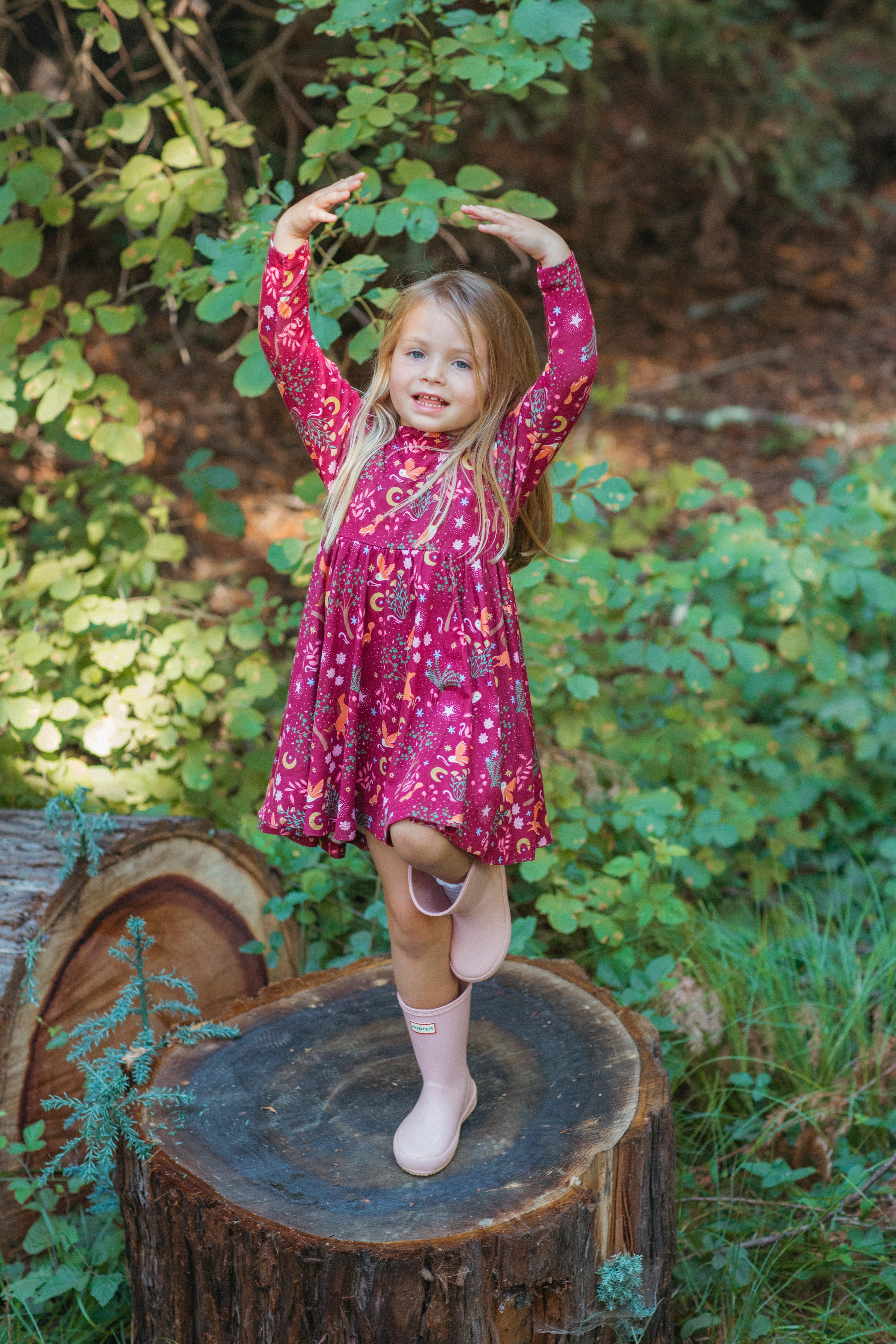 Close-up detail of the Woodland Dreams bamboo blend twirly dress print featuring enchanted trees and moons
