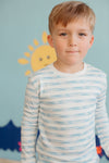 Close-up of Apple Park bamboo blend pajama top showing Breezy Bay Stripe print and ribbed cuffs on a child