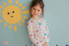 Close-up of child in Apple Park Seaside Treasures bamboo blend pajamas showing ribbed cuffs and soft fabric detail