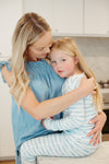 Child wearing Apple Park Breezy Bay Stripe two-piece bamboo pajamas — long sleeve top and matching stripe pants