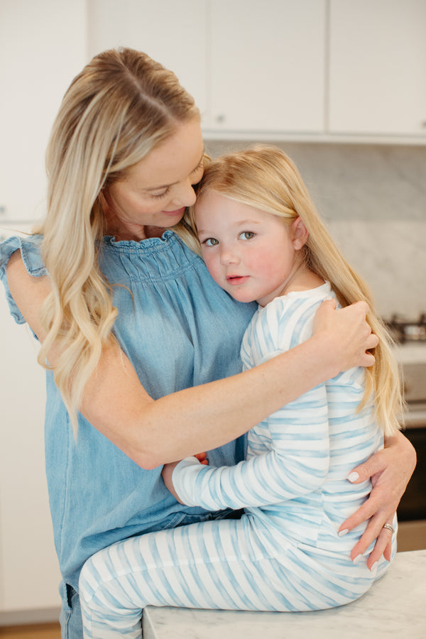 Child wearing Apple Park Breezy Bay Stripe two-piece bamboo pajamas — long sleeve top and matching stripe pants