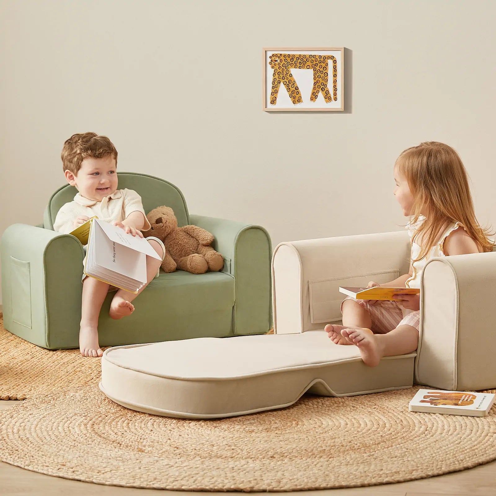 Child sitting comfortably on the Tiny Land foldable toddler sofa chair in beige white with soft armrests