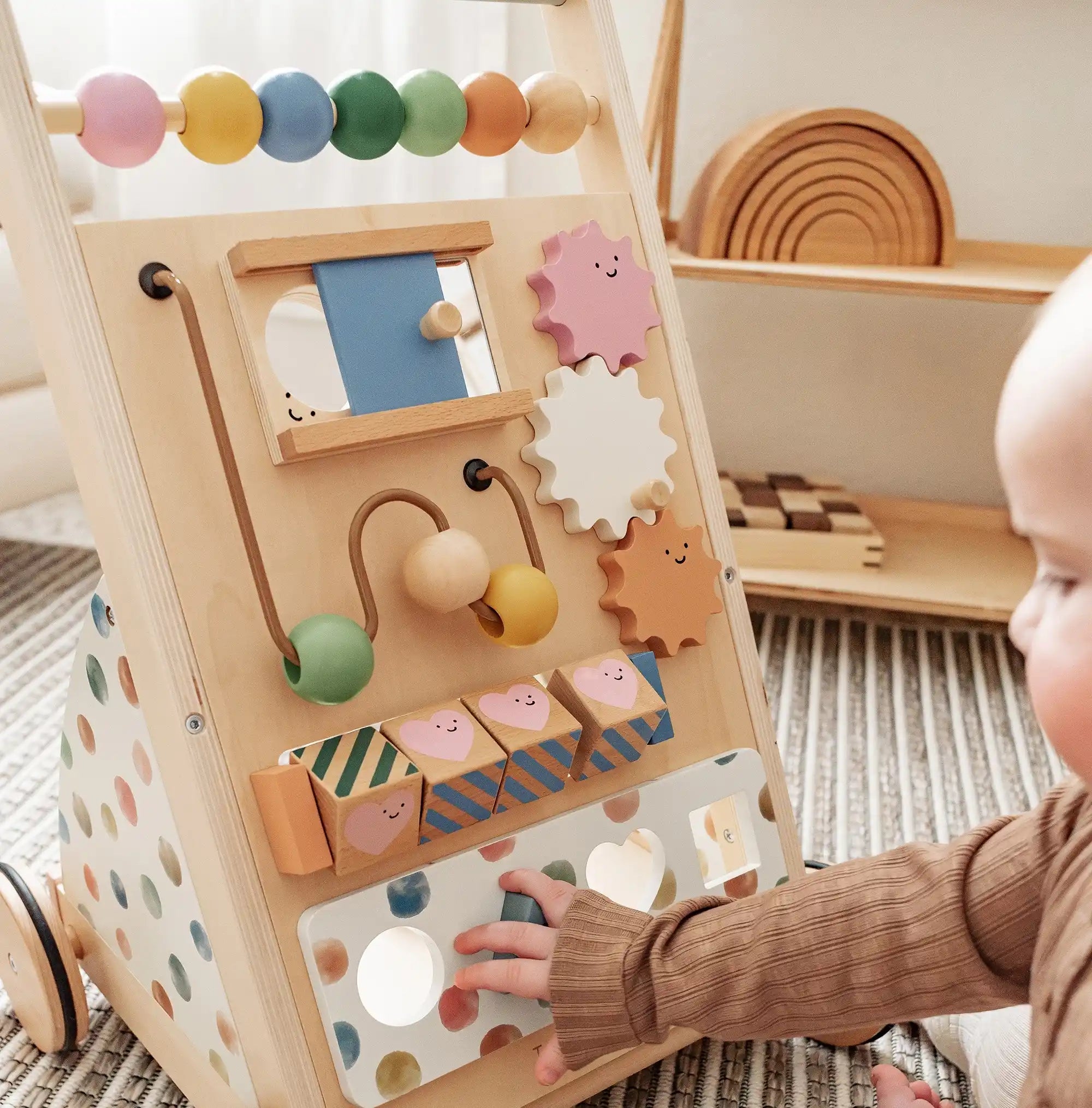 Child playing with a wooden activity toy in a home setting