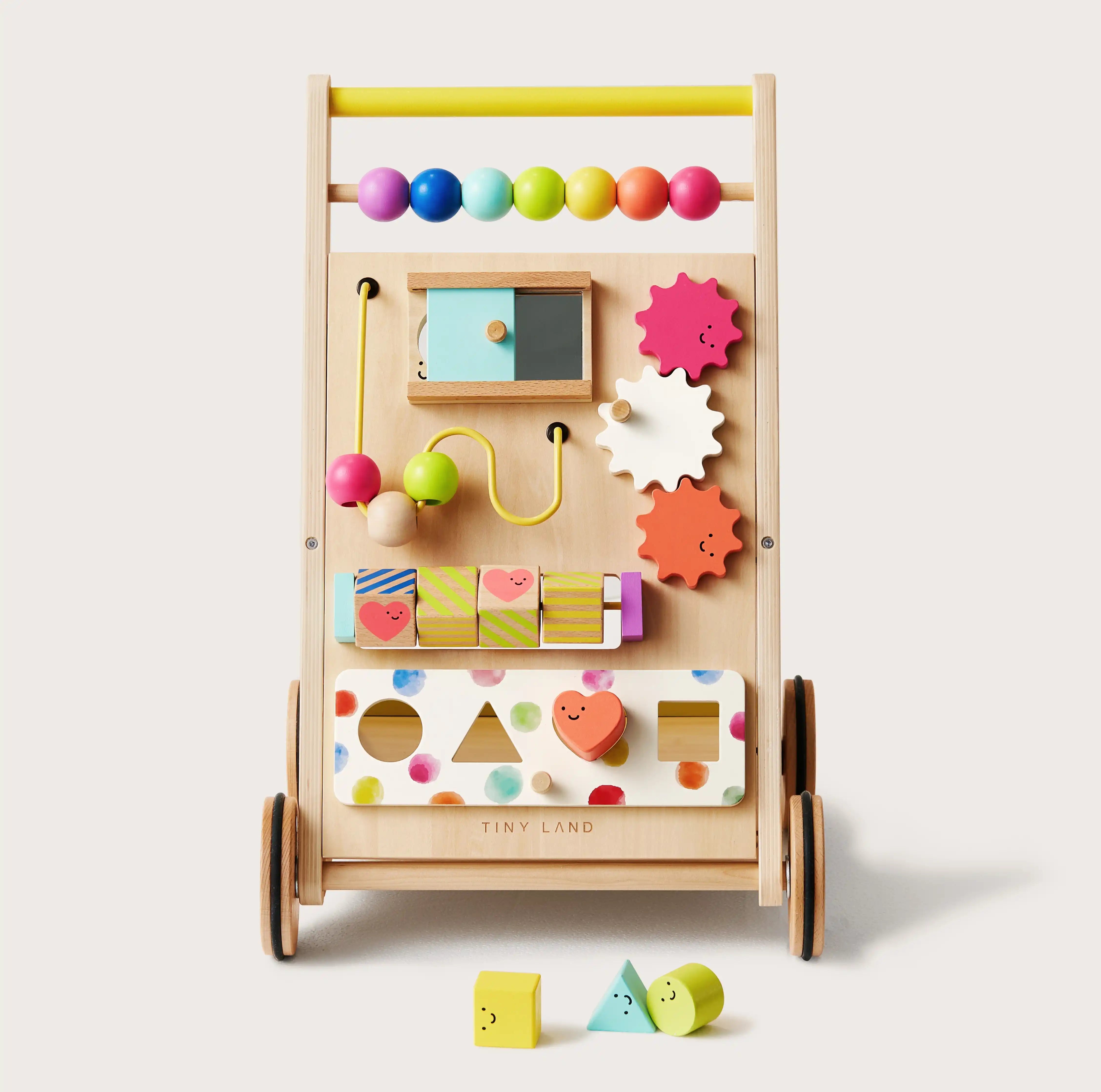Colorful wooden toy with various shapes and a small mirror on a white background