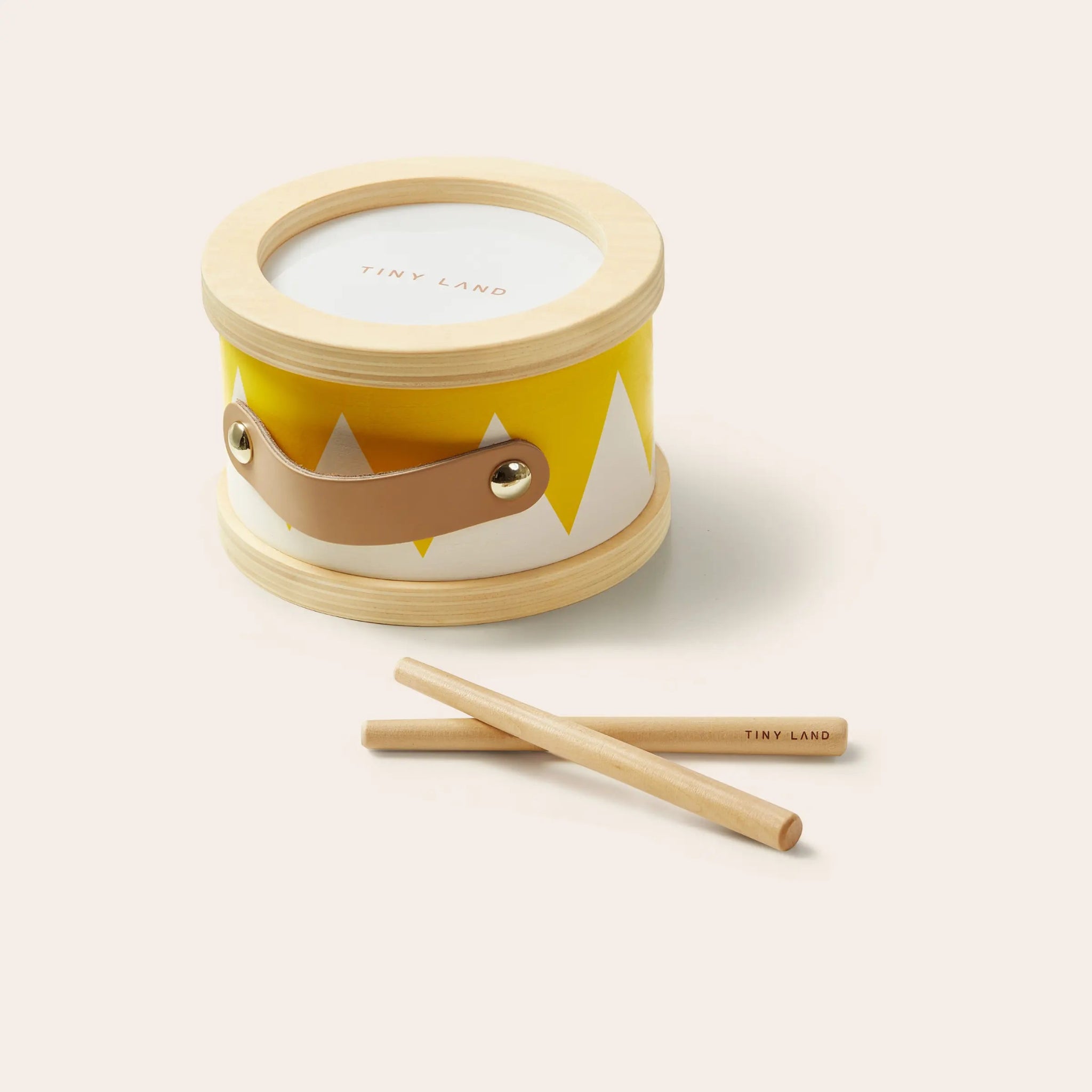 Small drum with fox design and two drumsticks on a white background
