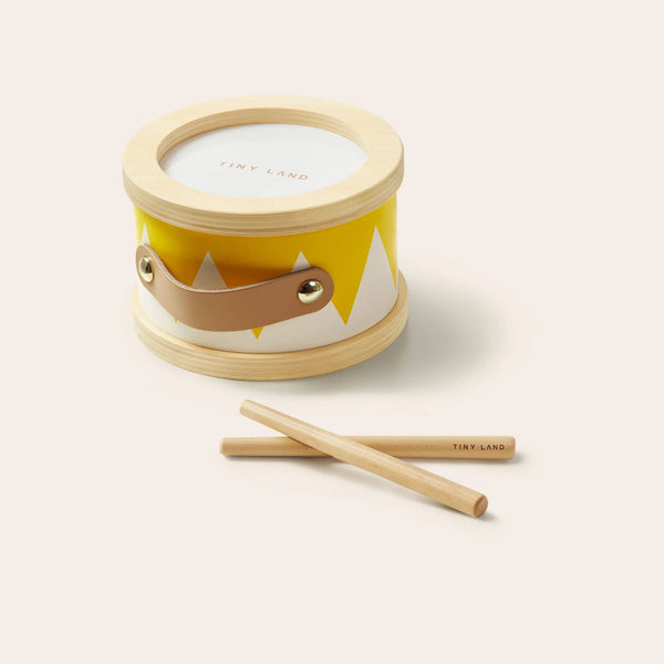 Small drum with fox design and two drumsticks on a white background