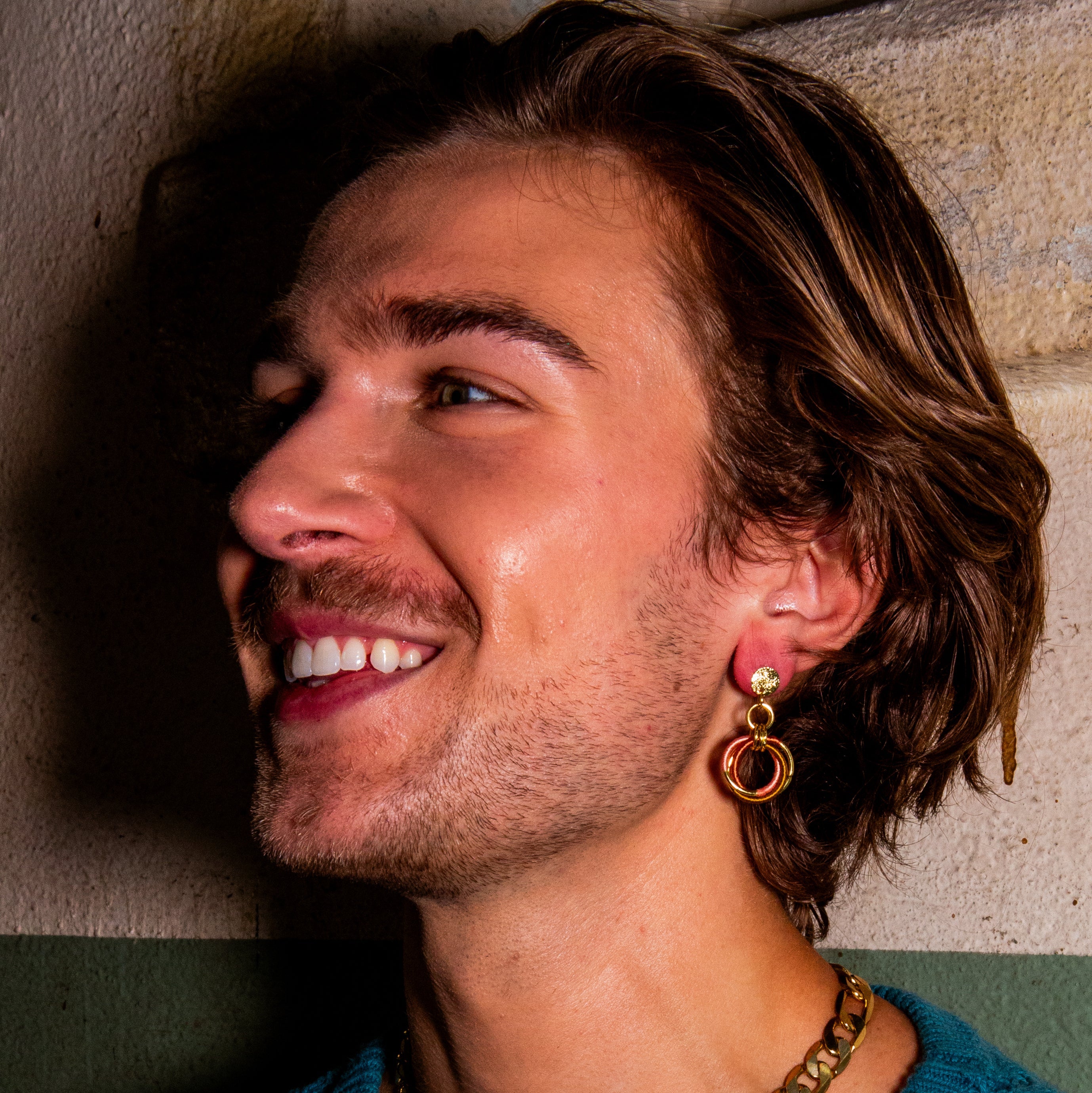 Close-up of gold-plated Thread Wrapped Helix Studs showing cotton thread detail and recycled brass construction