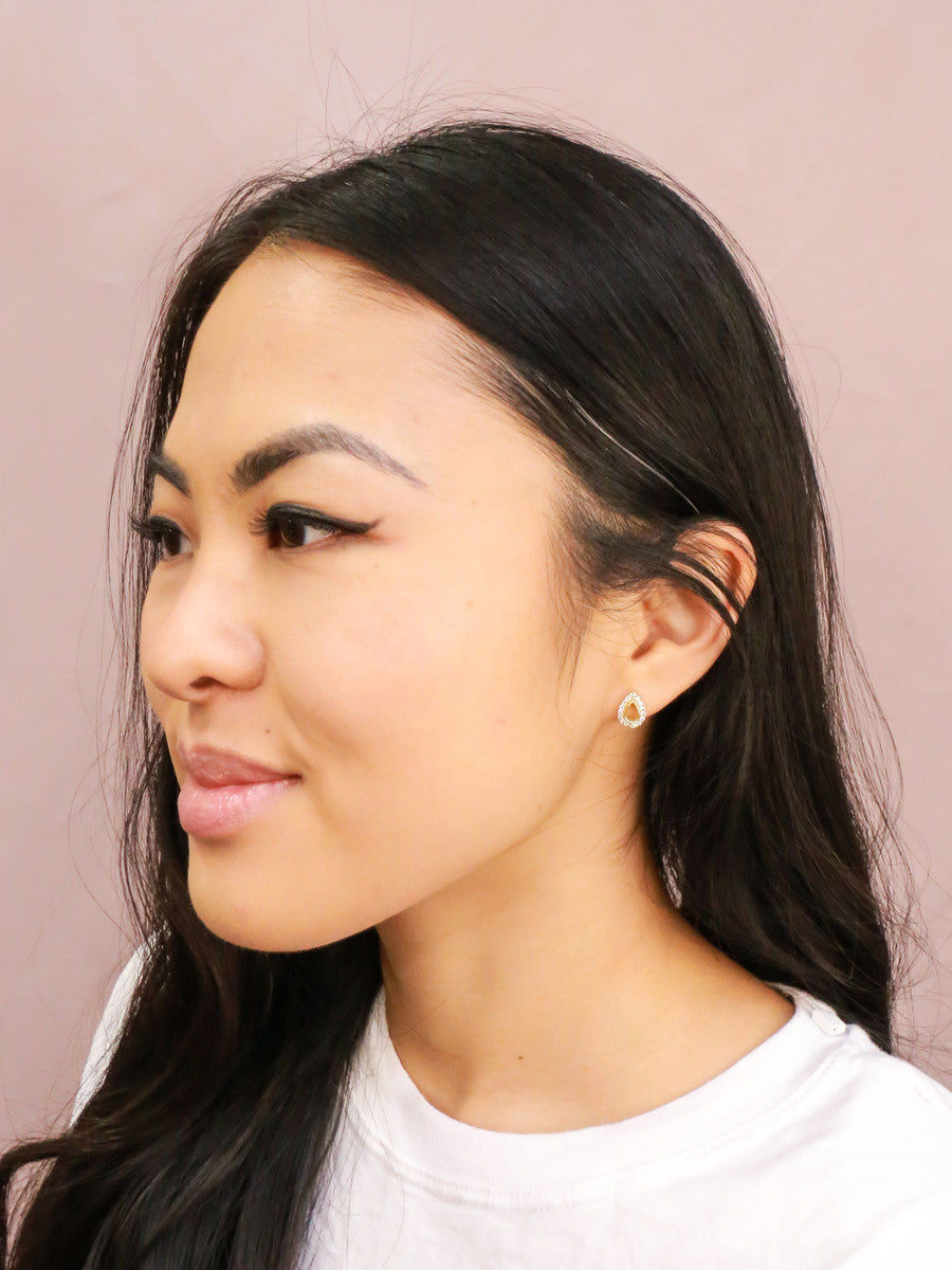 Close-up of Fair Anita Tiny Sparkle Teardrop Stud Earrings showing sparkly stone detail and teardrop shape