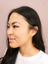Close-up of Fair Anita Tiny Sparkle Teardrop Stud Earrings showing sparkly stone detail and teardrop shape