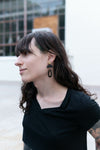 Model wearing Fair Anita oval horn earrings — nickel-free, ethically handmade in India