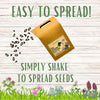 Seed packet with text 'Easy to spread! Simply shake to spread seeds' on a wooden background with plants.