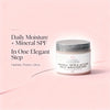 Jar of organic daily moisturizer with text on a pink background