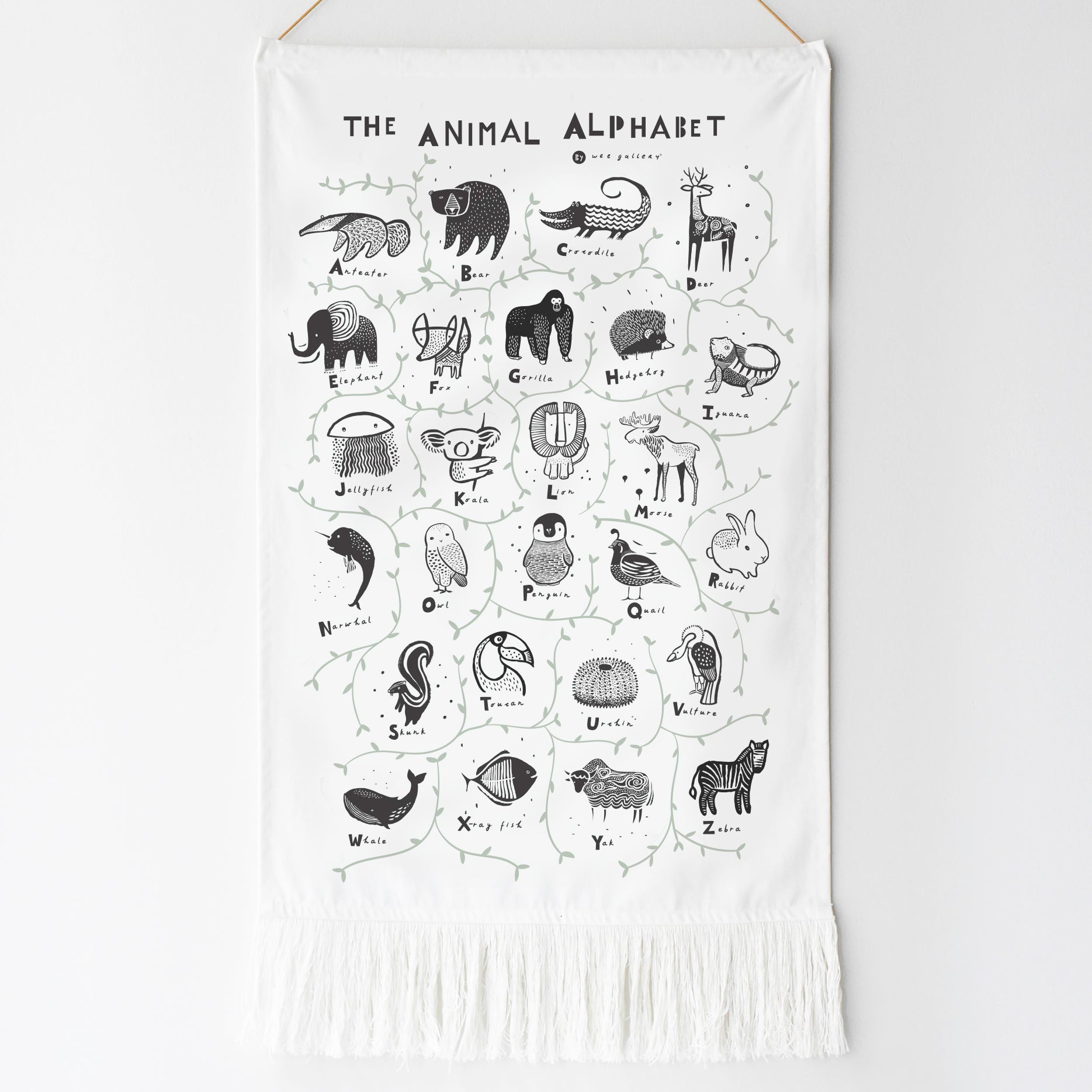 White wall hanging with black animal illustrations and text on a white background