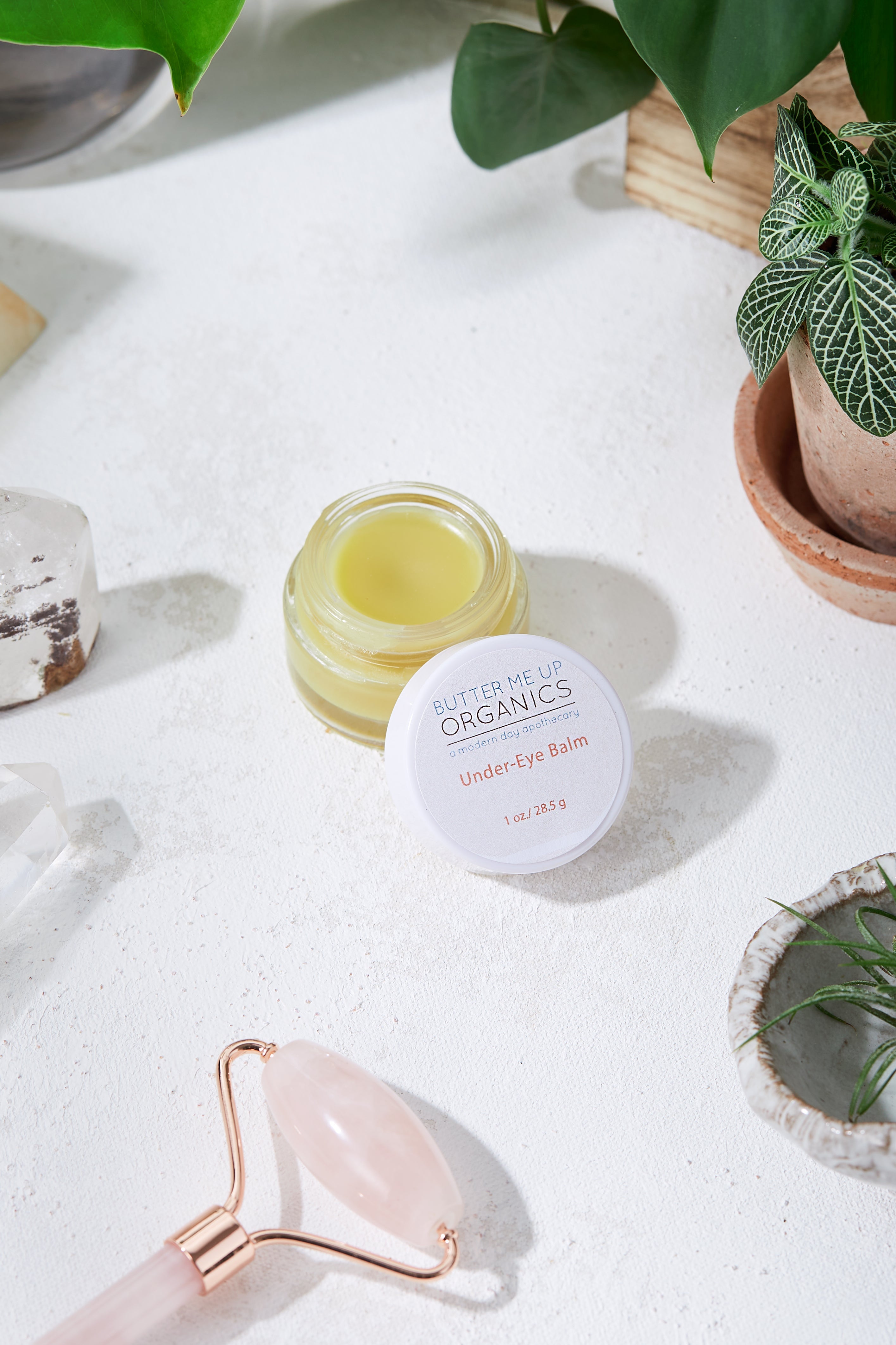 Butter Me Up Organics under eye balm jar showing certified organic caffeinated formula