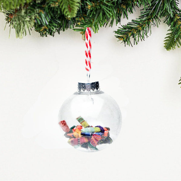 Find peace and tranquility with our Worry Globe Ornament. This enchanting piece features 12 mini worry dolls, inspired by ancient Guatemalan tradition. A perfect gift for any occasion, it's a beautiful and practical way to relieve stress and find serenity.