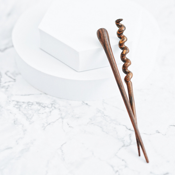 Keep your hair in style with our handcrafted wooden hair stick. This eco-friendly and stylish accessory is perfect for any occasion.