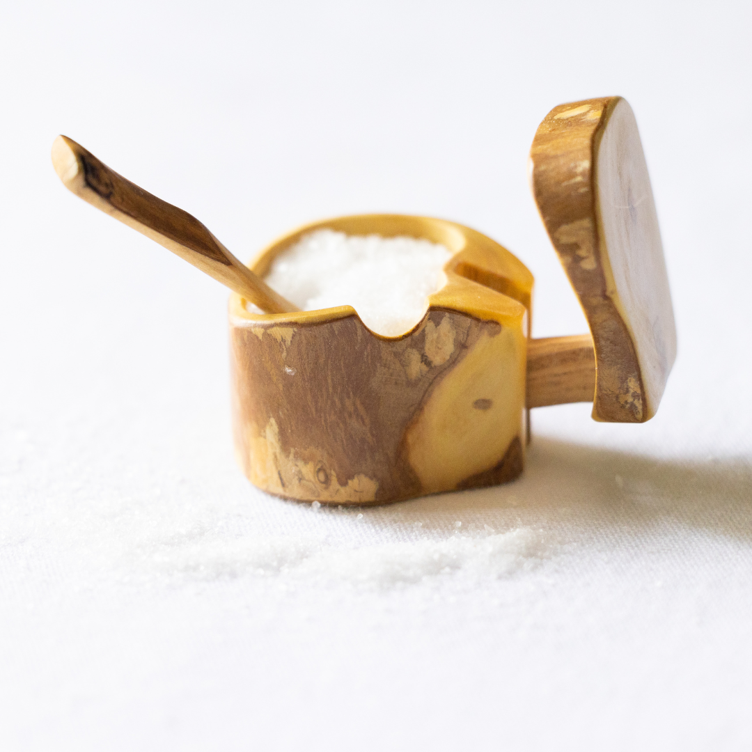 Add a touch of rustic charm to your kitchen with our eco-friendly Mini Salt Box and Spoon Set. Made from reclaimed coffee roots and featuring a unique design, this set is both functional and sustainable. Order yours today!