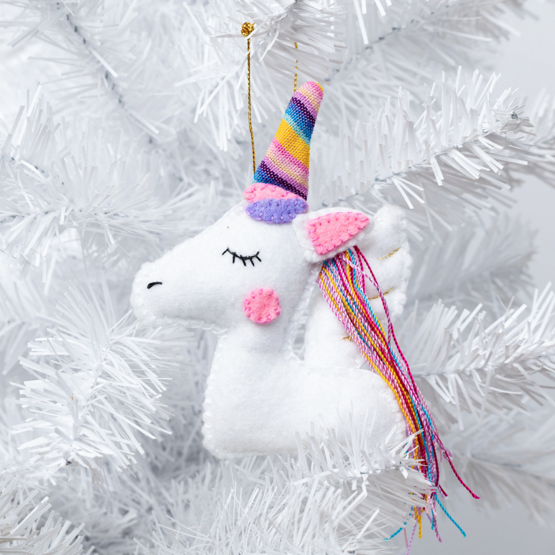 Add a touch of magic to your holiday decor with our adorable Felt Unicorn Ornament. Made from sustainable materials and featuring vibrant colors, this ornament is the perfect addition to any Christmas tree. Order yours today!