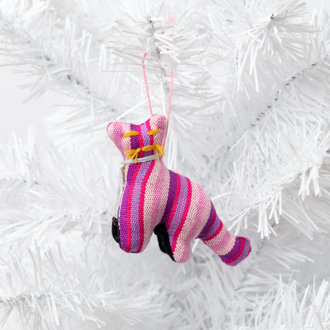 Add a touch of whimsy to your home with our adorable Animalitos. These handcrafted decorations are made from sustainable cotton and support fair trade practices.