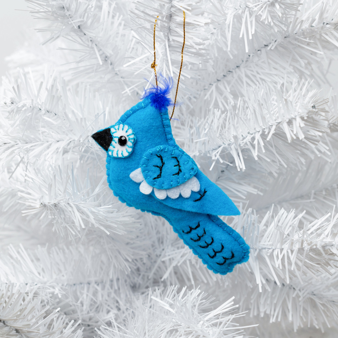 Add a touch of nature to your holiday decor with our adorable Felt Bluejay Ornament. Made from sustainable materials and featuring intricate embroidery, this ornament is the perfect addition to any Christmas tree. Order yours today!