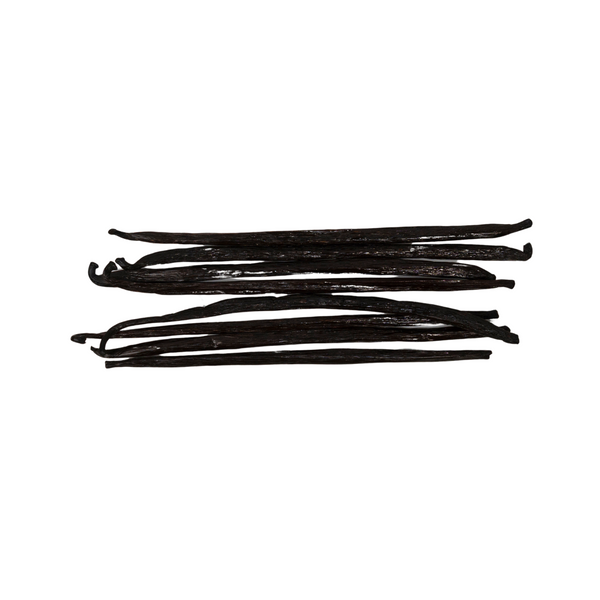 Five dark brown vanilla beans on a white background