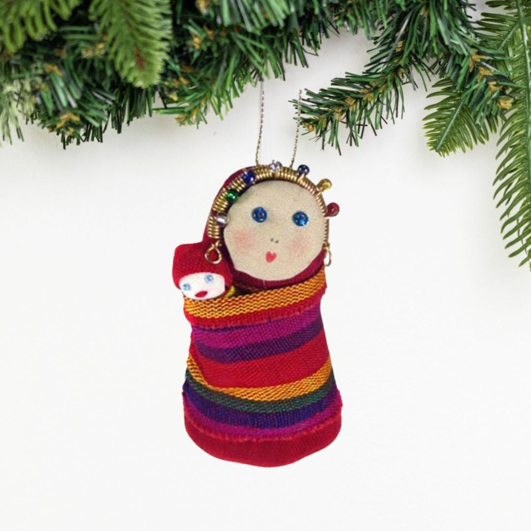 Add a touch of tradition and beauty to your Christmas tree with our handcrafted Mary and Jesus ornament. This fair trade piece is perfect for any home.