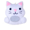 Cat-shaped ornament on a white background with greenery above